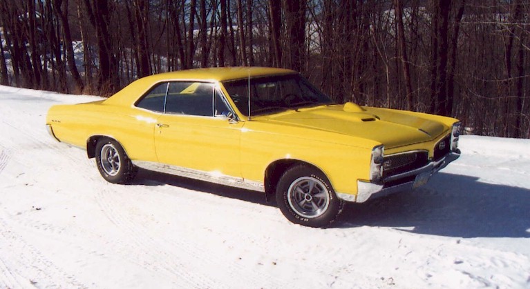Yellow 67 GTO in the snow
